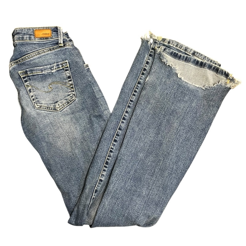 Subdued Soft Flare Distressed Light Wash Jeans